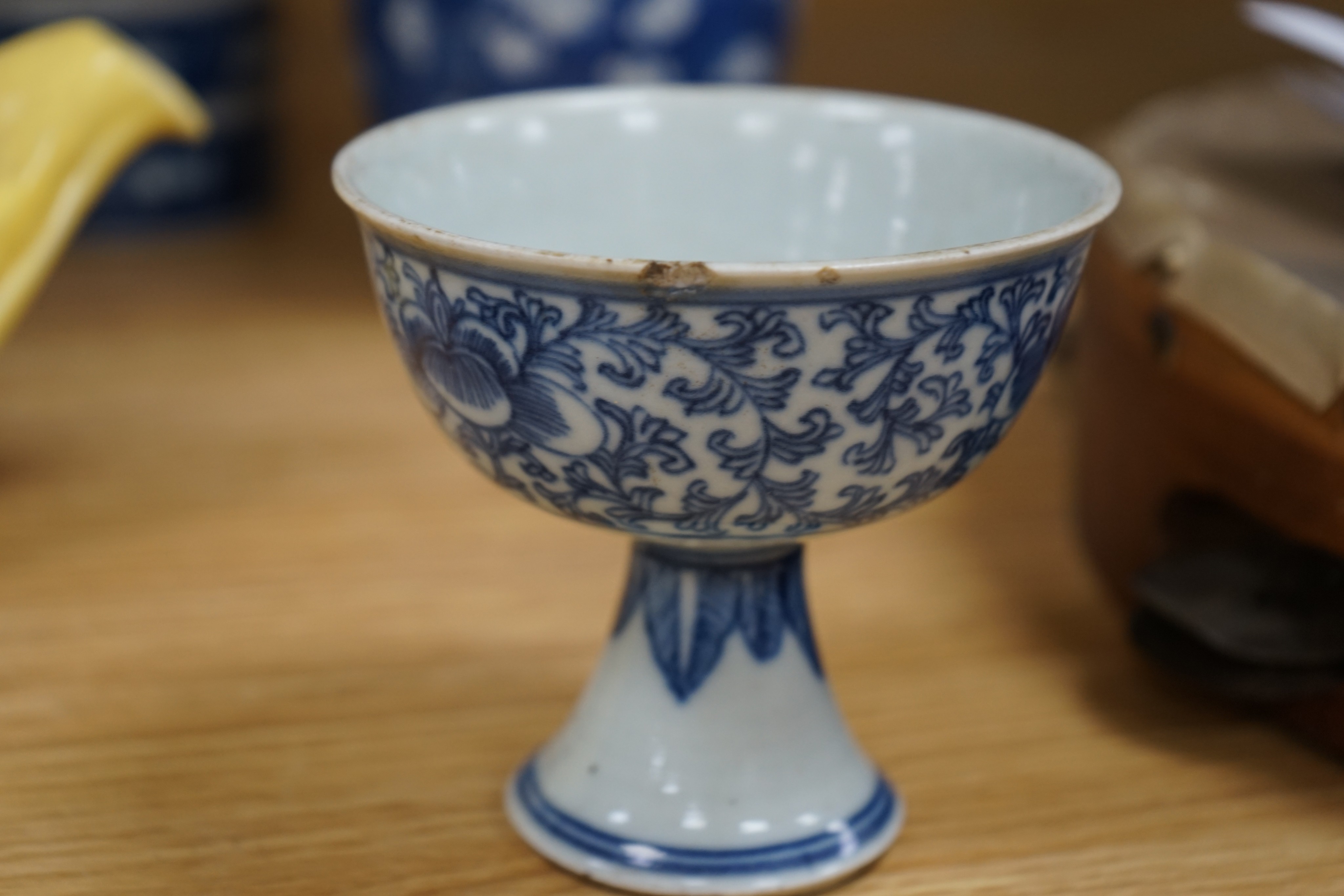 A Chinese blue and white ovoid jar and cover and similar stacking box, Kangxi and a Qing blue and white footed cup, tallest 15cm